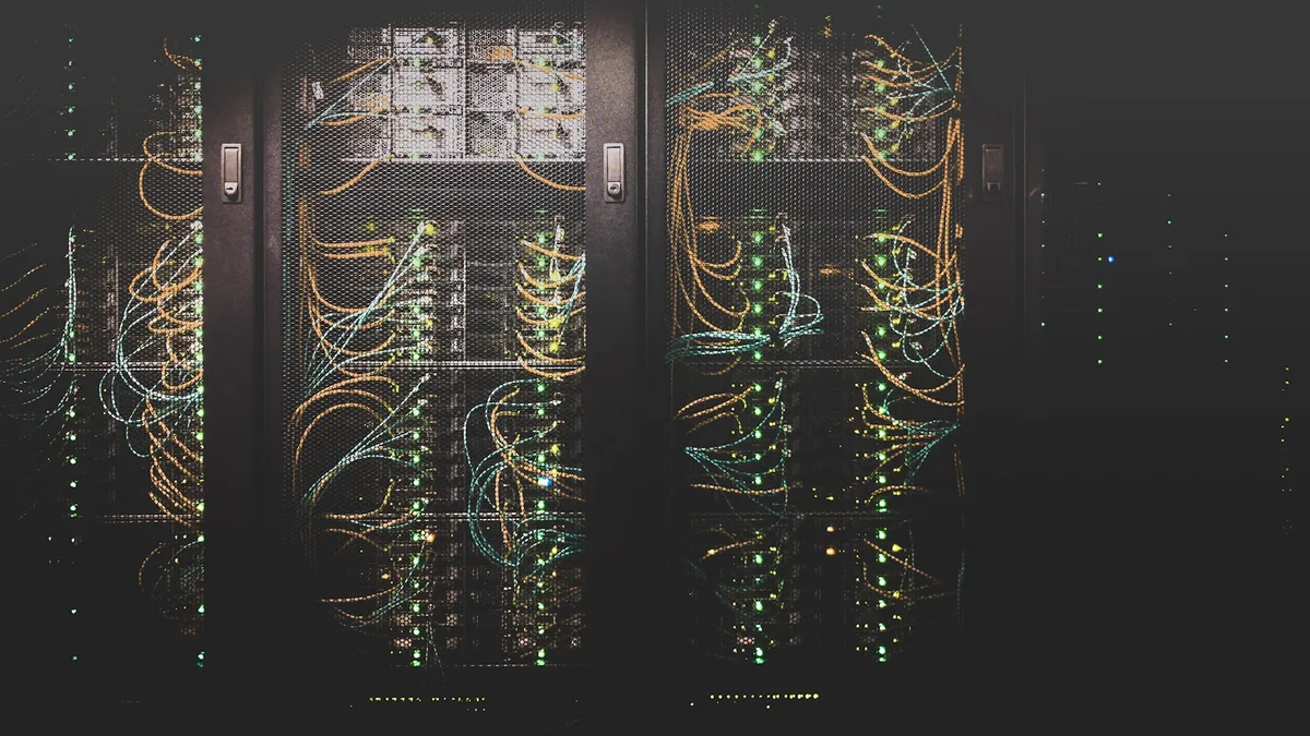 Network cabling and servers inside secured equipment racks.