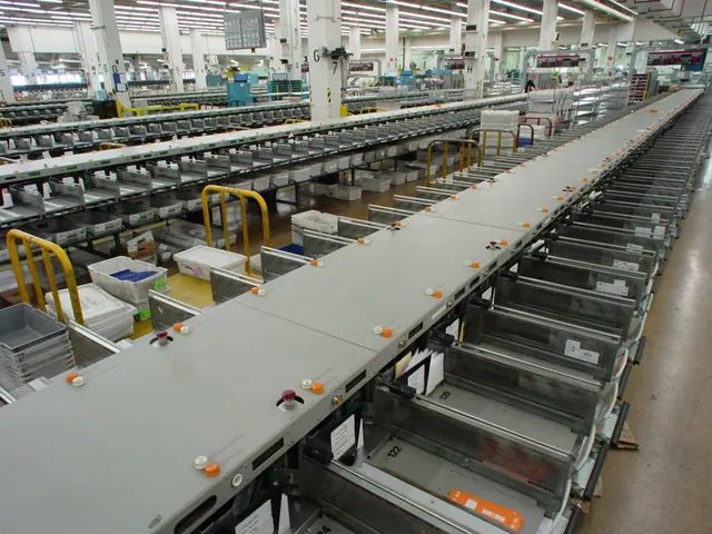 Conveyor belts and sorting bins inside a physical mail-sorting facility, photographed in 2005.