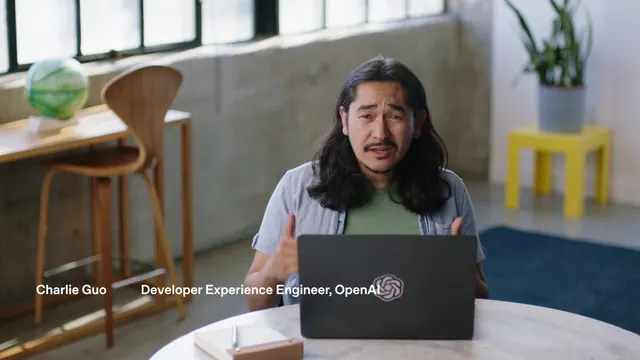 OpenAI developer experience engineer Charlie Guo presenting the Agents API from an OpenAI laptop