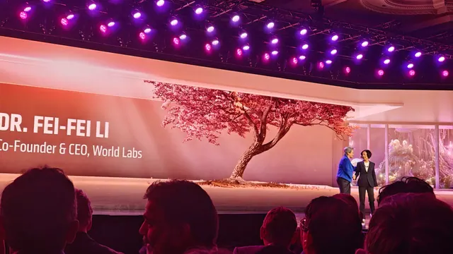 Lisa Su and Fei-Fei Li stand together on the AMD CES 2026 stage in front of a World Labs presentation.